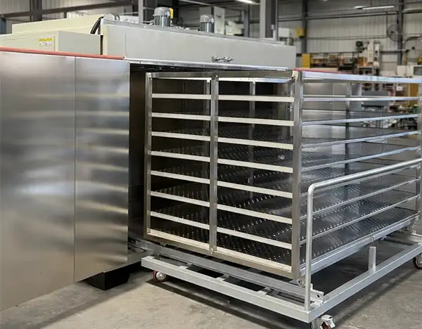Trolley type curing oven with side view — customizable load racks for different part sizes